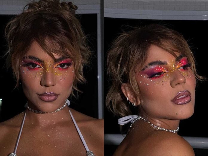 Hariany Almeida adotou aplicações de pedras ao redor dos olhos em seu look (Fotos: Divulgação/@mouraacarlos/CO ASSESSORIA)
